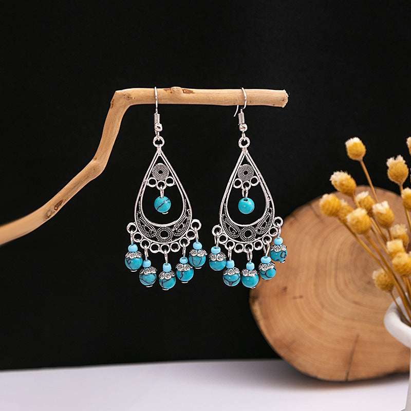 Wholesale Hollow Circular Flower Tassel Alloy Earrings